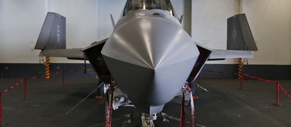 An F-35C Lightning II test aircraft is on static display in the hanger deck of the nuclear powered aircraft carrier USS Dwight D. Eisenhower of the coast of Norfolk, Va., Friday, Oct. 9, 2015. - Sputnik International