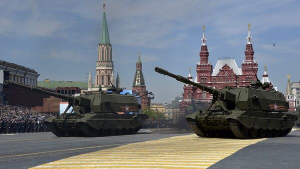Russian 2S-35 Coalition-SV self-propelled 152 mm howitzers drive during the Victory Day military parade at Red Square in Moscow on May 9, 2015 - Sputnik International
