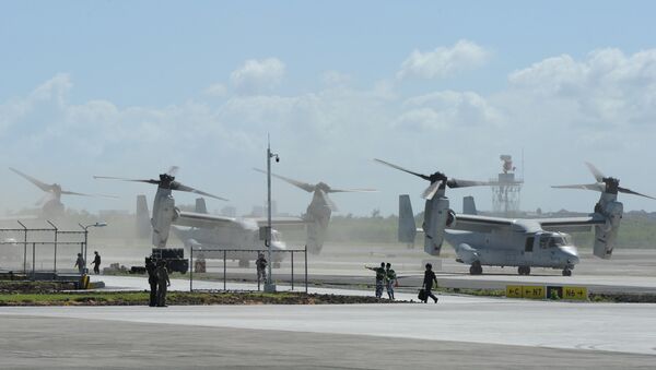 US Marine V-22 Osprey aircraft (R) taxi on the tarmac after the arrival of US President Barack Obama at the international airport in Manila on November 17, 2015, to attend the Asia-Pacific Economic Cooperation (APEC) summit - Sputnik International