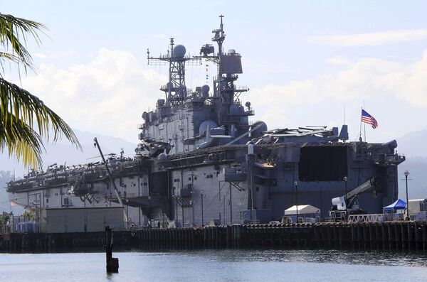 The amphibious assault ship USS Peleliu which took part in the joint military exercise with their Philippine counterpart is docked at the Alava pier, off Subic Bay Freeport zone in Zambales province in northwestern Philippines Monday, Oct. 13, 2014 - Sputnik International