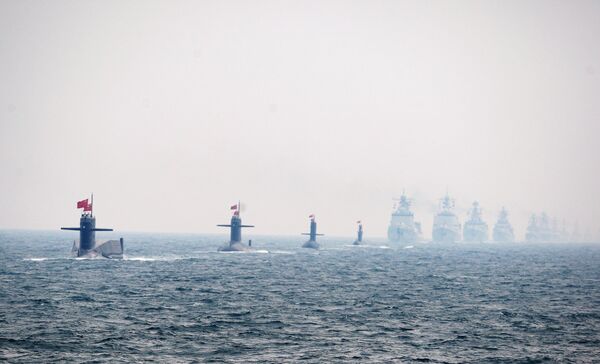 Four Chinese Navy submarines (L) and warships attend an international fleet review to celebrate the 60th anniversary of the founding of the People's Liberation Army Navy on April 23, 2009 off Qingdao in Shandong Province - Sputnik International