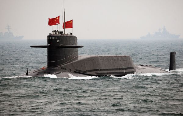 A Chinese Navy submarine attends an international fleet review to celebrate the 60th anniversary of the founding of the People's Liberation Army Navy on April 23, 2009 off Qingdao in Shandong Province - Sputnik International