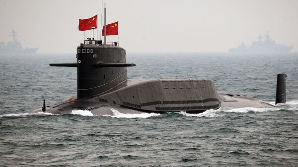A Chinese Navy submarine attends an international fleet review to celebrate the 60th anniversary of the founding of the People's Liberation Army Navy on April 23, 2009 off Qingdao in Shandong Province - Sputnik International