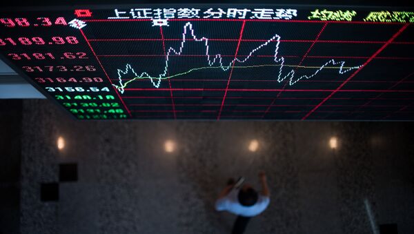 A board shows the stock movements inside the Shanghai Stock Exchange in the Lujiazui Financial district of Shanghai on September 22, 2015 - Sputnik International