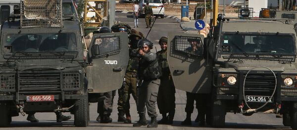 Israeli security forces keep position as they prevent Palestinians from approaching the Jalama border crossing between Israel and the occupied West Bank on Novembre 2, 2015. Israeli security forces keep position as they prevent Palestinians from approaching the Jalama border crossing between Israel and the occupied West Bank on Novembre 2, 2015. - Sputnik International