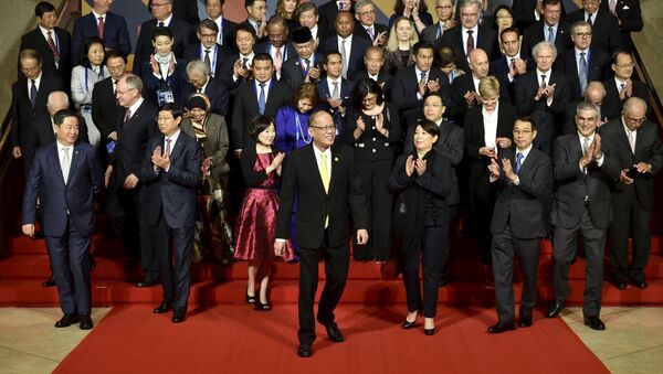 Philippine President Benigno Aquino (C) is joined by other leaders and representatives of the APEC Business Advisory Council (ABAC) for a group photo, ahead of the official welcome for Asia-Pacific Economic Cooperation (APEC) leaders in Manila November 18, 2015 - Sputnik International