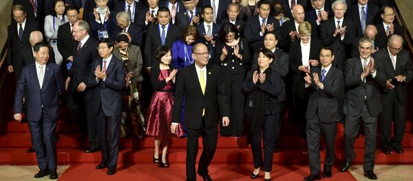 Philippine President Benigno Aquino (C) is joined by other leaders and representatives of the APEC Business Advisory Council (ABAC) for a group photo, ahead of the official welcome for Asia-Pacific Economic Cooperation (APEC) leaders in Manila November 18, 2015 Philippine President Benigno Aquino (C) is joined by other leaders and representatives of the APEC Business Advisory Council (ABAC) for a group photo, ahead of the official welcome for Asia-Pacific Economic Cooperation (APEC) leaders in Manila November 18, 2015 - Sputnik International