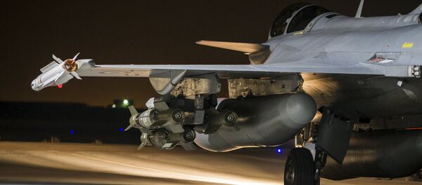 A French fighter jet is seen on the runway at an undisclosed location, in this picture released by the ECPAD November 17, 2015. French warplanes targeted a command post and a recruitment centre for jihadists in the Islamic State stronghold of Raqqa in the second consecutive night of strikes ordered by the French president - Sputnik International