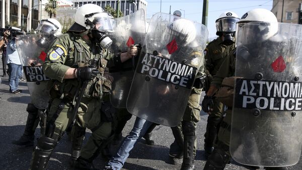 Policemen detain a farmer during an anti-government protest at central Syntagma square in Athens - Sputnik International