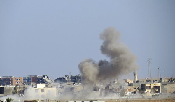 Smoke rises from Islamic State positions following a US-led coalition airstrike Smoke rises from Islamic State positions following a US-led coalition airstrike - Sputnik International