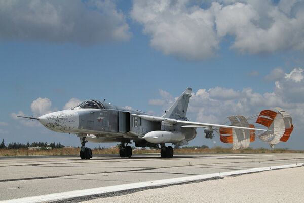 A Russian Su-24 front-line bomber jet lands at Latakia airport, Syria A Russian Su-24 front-line bomber jet lands at Latakia airport, Syria - Sputnik International