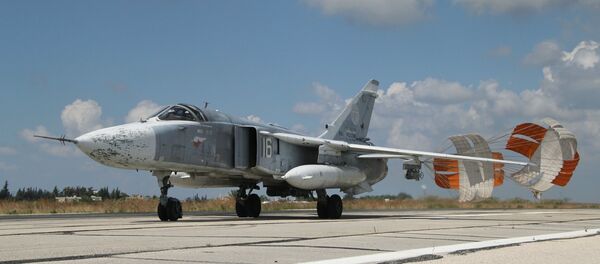 A Russian Su-24 front-line bomber jet lands at Latakia airport, Syria. - Sputnik International