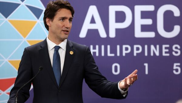 Canadian Prime Minister Justin Trudeau addresses a press conference at the close of the Asia-Pacific Economic Cooperation (APEC) summit in Manila, Philippines, Thursday, Nov. 19, 2015. - Sputnik International