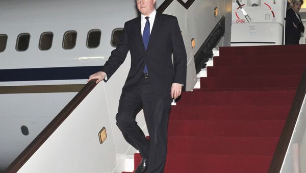 British Prime Minister David Cameron walking down the stairs of an airplane - Sputnik International