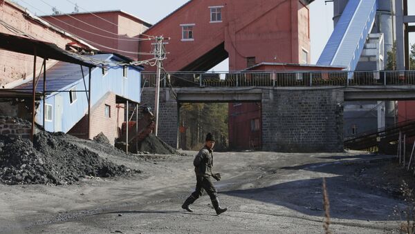 A miner walks at a coal mine, China - Sputnik International