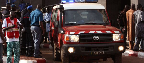 An ambulance seen outside the Radisson Blu hotel, after an attack by gunmen on the hotel, in Bamako, Mali, Friday, Nov. 20, 2015. Islamic extremists armed with guns and grenades stormed the luxury Radisson Blu hotel in Mali's capital Friday morning, and security forces worked to free guests floor by floor. An ambulance seen outside the Radisson Blu hotel, after an attack by gunmen on the hotel, in Bamako, Mali, Friday, Nov. 20, 2015. Islamic extremists armed with guns and grenades stormed the luxury Radisson Blu hotel in Mali's capital Friday morning, and security forces worked to free guests floor by floor. - Sputnik International