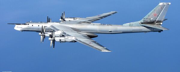 A Russian Tu-95 Bear 'H' photographed from a RAF Typhoon Quick Reaction Alert aircraft (QRA) with 6 Squadron from RAF Leuchars in Scotland in April 2014 - Sputnik International