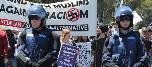 Members of the Campaign Against Racism and Fascism hold a counter-rally against anti-Islam group Reclaim Australia, as the latter group - who have organised county-wide protests around the country in the wake of the Paris terror attacks - protest over plans for a mosque in Melton, in Melbourne on November 22, 2015. Members of the Campaign Against Racism and Fascism hold a counter-rally against anti-Islam group Reclaim Australia, as the latter group - who have organised county-wide protests around the country in the wake of the Paris terror attacks - protest over plans for a mosque in Melton, in Melbourne on November 22, 2015. - Sputnik International