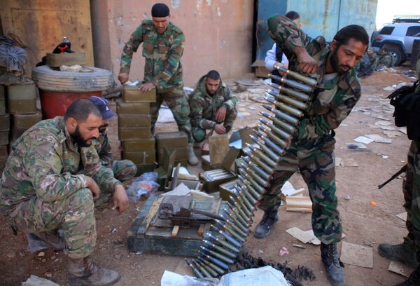 Syrian pro-government forces prepare their weapons at a train station in the area of Arkile near the airport of Kweyris, in the northern Syrian province of Aleppo, on November 20, 2015 Syrian pro-government forces prepare their weapons at a train station in the area of Arkile near the airport of Kweyris, in the northern Syrian province of Aleppo, on November 20, 2015 - Sputnik International