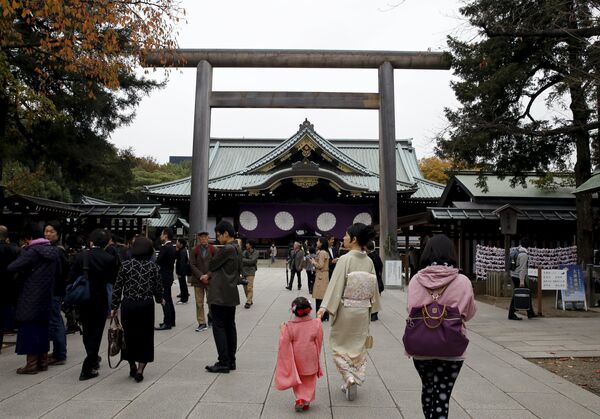 People walk near the main shrine after a blast at the precinct of the Yasukuni shrine in Tokyo, Japan, November 23, 2015 People walk near the main shrine after a blast at the precinct of the Yasukuni shrine in Tokyo, Japan, November 23, 2015 - Sputnik International
