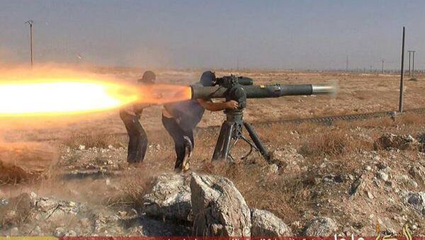 In this picture released on June 26, 2015, by a website of Islamic State militants, Islamic State militants fire an anti-tank missile in Hassakeh, northeast Syria - Sputnik International