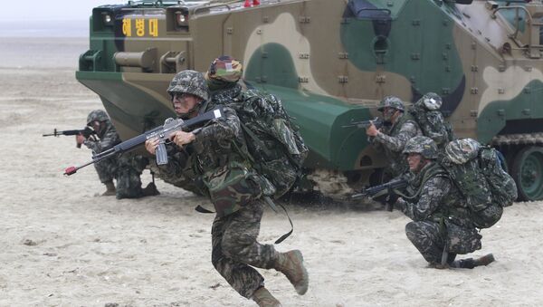 South Korean Marines come out from a landing craft during a landing exercise on the beach in Taean, western South Korea, Monday, June 29, 2015 - Sputnik International