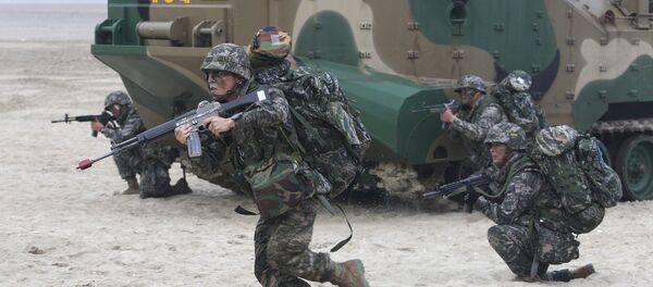 South Korean Marines come out from a landing craft during a landing exercise on the beach in Taean, western South Korea, Monday, June 29, 2015 - Sputnik International