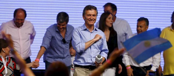 Mauricio Macri, presidential candidate of the Cambiemos (Let's Change) coalition, gestures to his supporters after the presidential election in Buenos Aires, Argentina, November 22, 2015 - Sputnik International
