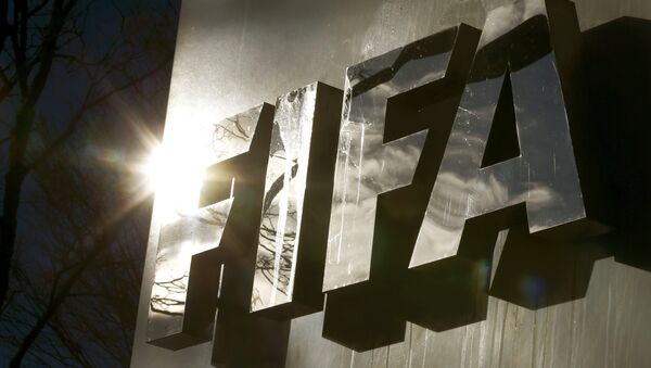 The sun is reflected in FIFA's logo in front of FIFA's headquarters in Zurich, Switzerland November 19, 2015 - Sputnik International