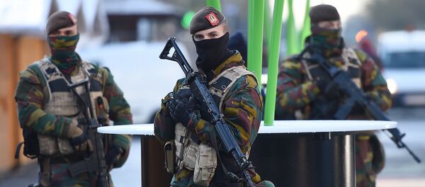 Soldiers patrol as the Belgian capital remains on the highest possible alert level on November 23, 2015 in Brussels - Sputnik International