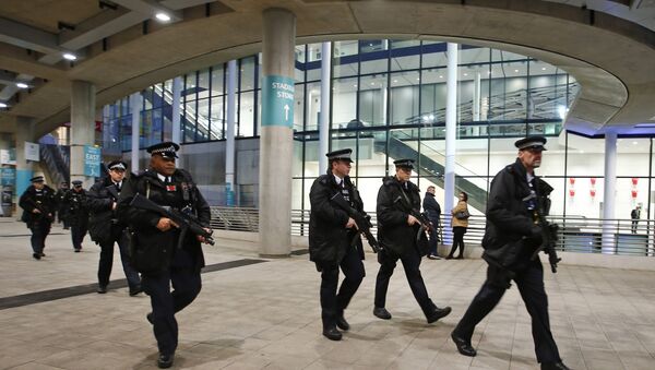 Armed police patrol at Wembley Stadium, in London, prior to the international friendly soccer match between England and France which takes place at Wembley Stadium, Tuesday, Nov. 17, 2015 - Sputnik International
