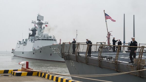 SHANGHAI (Nov. 20, 2015) Sailors aboard the forward-deployed Arleigh Burke-class guided missile destroyer USS Stethem (DDG 63) prepare to leave port while the People’s Liberation Army Navy Jiangkai II class guided-missile frigate Xuzhou (FFG 530) gets underway - Sputnik International