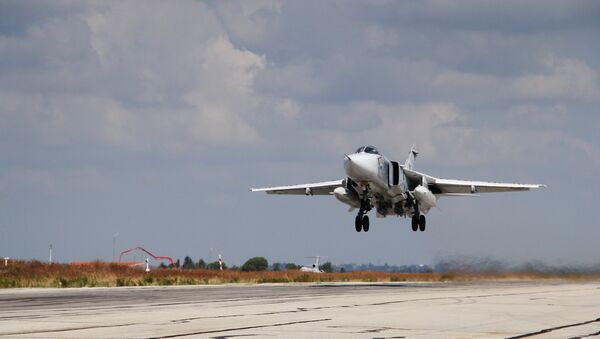 A Russian Su-24 strike aircraft takes off from the Khmeimim airbase in Syria. - Sputnik International