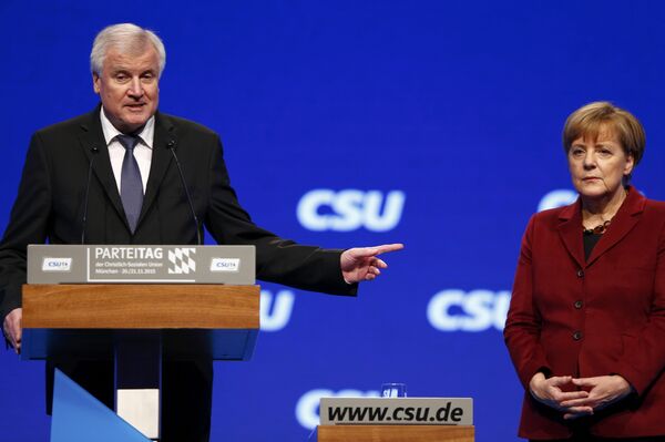 Bavarian Prime Minister and head of the Christian Social Union (CSU) Horst Seehofer welcomes German Chancellor Angela Merkel to the Christian Social Union (CSU) party congress in Munich, Germany in this November 20, 2015. Bavarian Prime Minister and head of the Christian Social Union (CSU) Horst Seehofer welcomes German Chancellor Angela Merkel to the Christian Social Union (CSU) party congress in Munich, Germany in this November 20, 2015. - Sputnik International