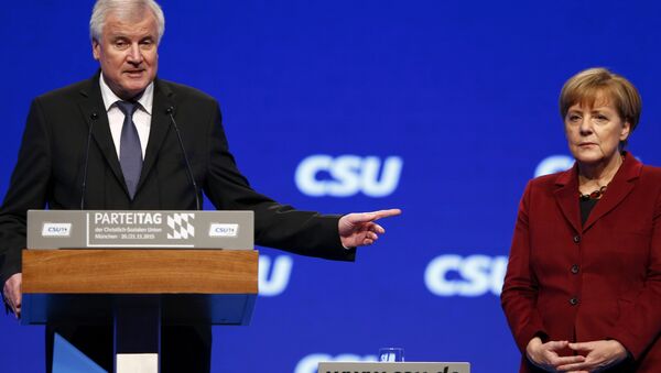 Bavarian Prime Minister and head of the Christian Social Union (CSU) Horst Seehofer welcomes German Chancellor Angela Merkel to the Christian Social Union (CSU) party congress in Munich, Germany in this November 20, 2015 file picture. - Sputnik International