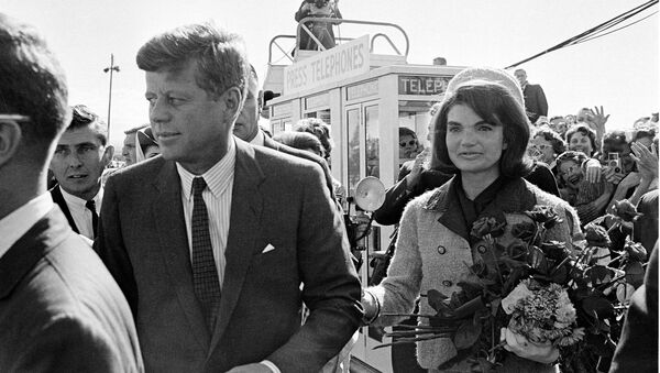 President John F. Kennedy and his wife Jacqueline Kennedy are greeted by an enthusiastic crowd upon their arrival at Dallas Airport, on November 22, 1963. Only a few hours later the president was assassinated while riding in an open-top limousine through the city. - Sputnik International