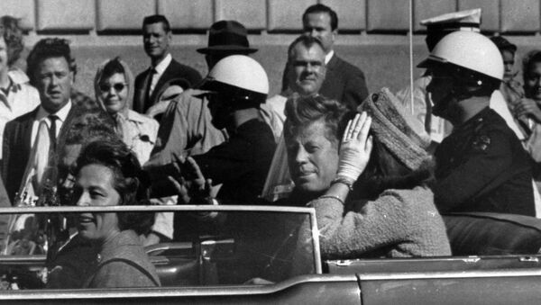 President John F. Kennedy is seen riding in motorcade approximately one minute before he was shot in Dallas, Tx., on Nov. 22, 1963. In the car riding with Kennedy are Mrs. Jacqueline Kennedy, right, Nellie Connally, left, and her husband, Gov. John Connally of Texas. - Sputnik International