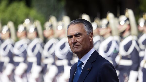 Portuguese President Anibal Cavaco Silva stands in front of a honor guard while waiting for the arrival of Senegal's President Macky Sall at the Belem presidential palace in Lisbon Tuesday, Sept. 8 2015. - Sputnik International