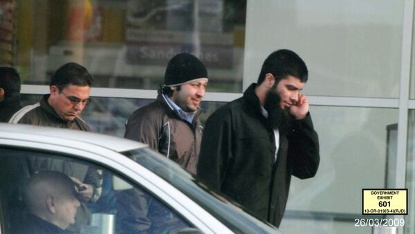 In this image taken from surveillance video on March 26, 2009, and provided by the United States Attorney’s Office, Abid Naseer, right, talks on a cell phone while walking along a street in Manchester, England - Sputnik International
