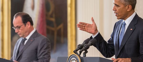 French President Francois Hollande listens as President Barack Obama speaks during their joint news conference in the East Room of the White House in Washington, Tuesday, Nov. 24, 2015 French President Francois Hollande listens as President Barack Obama speaks during their joint news conference in the East Room of the White House in Washington, Tuesday, Nov. 24, 2015 - Sputnik International