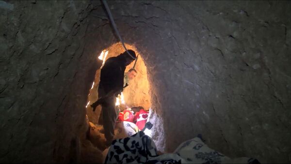 In this image made from video taken on Sunday, Nov. 22, 2015, Kurdish security forces are seen in a tunnel complex under the city of Sinjar, northern Iraq that were used by Islamic State fighters to move undetected and avoid coalition airstrikes before the town was retaken from the militants. - Sputnik International