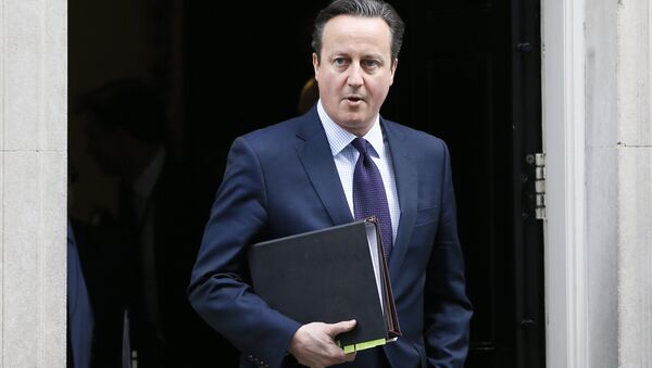 Britain's Prime Minister David Cameron leaves 10 Downing Street to attend Parliament in London, Thursday, Nov. 26, 2015. - Sputnik International