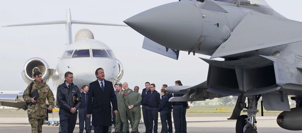 Britain's Prime Minister David Cameron (3rd L) looks at an RAF Eurofighter Typhoon fighter jet during his visit to Royal Air Force station RAF Northolt in London, Britain November 23, 2015. - Sputnik International