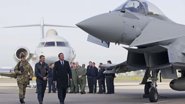 Britain's Prime Minister David Cameron (3rd L) looks at an RAF Eurofighter Typhoon fighter jet during his visit to Royal Air Force station RAF Northolt in London, Britain November 23, 2015. - Sputnik International