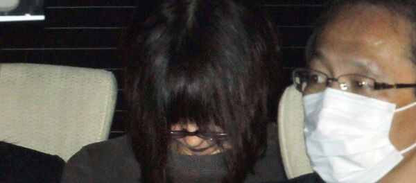 Naoko Kikuchi, an alleged former member of Japan's Aum Supreme Truth, is driven from the headquarters of the Tokyo Metropolitan Police in Sagamihara city, suburban Tokyo - Sputnik International