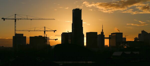 Buildings under construction are seen during a sunrise in central Brussels, Belgium, November 26, 2015 - Sputnik International