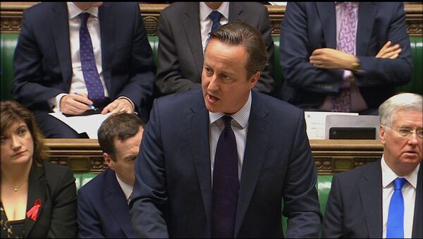Britain's Prime Minister, David Cameron addresses lawmakers in the House of Commons, London, making his case for airstrikes as part of a comprehensive overall strategy to destroy IS and end the Syrian war, Thursday, Nov. 26, 2015. - Sputnik International