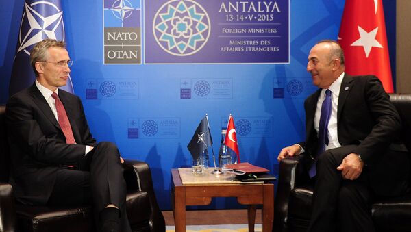 Turkish Foreign Minister Mevlut Cavusoglu (R) speaks with NATO Secretary General Jens Stoltenberg (L) during a meeting on May 12, 2015 in Antalya - Sputnik International