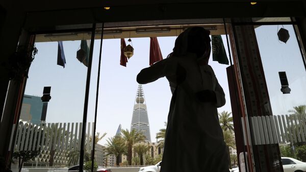 A Saudi man enters a hotel decorated for the Muslim holly month of Ramadan, Riyadh, Saudi Arabia, Monday, 15 June 2015.  - Sputnik International