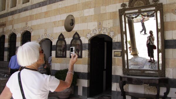 Tourist takes a photo during her visit to Al-Azem Palace that houses the museum of arts and popular traditions in the Old City of Damascus, Syria - Sputnik International